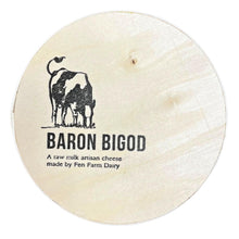 Round Baron Bigod cheese with a cow illustration and the text 'A raw milk artisan cheese made by Fen Farm Dairy' on a white background.