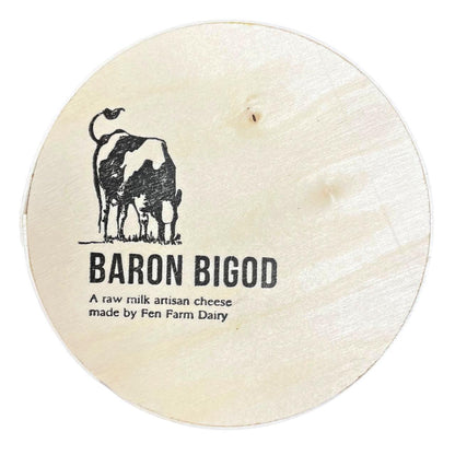 Round Baron Bigod cheese with a cow illustration and the text 'A raw milk artisan cheese made by Fen Farm Dairy' on a white background.
